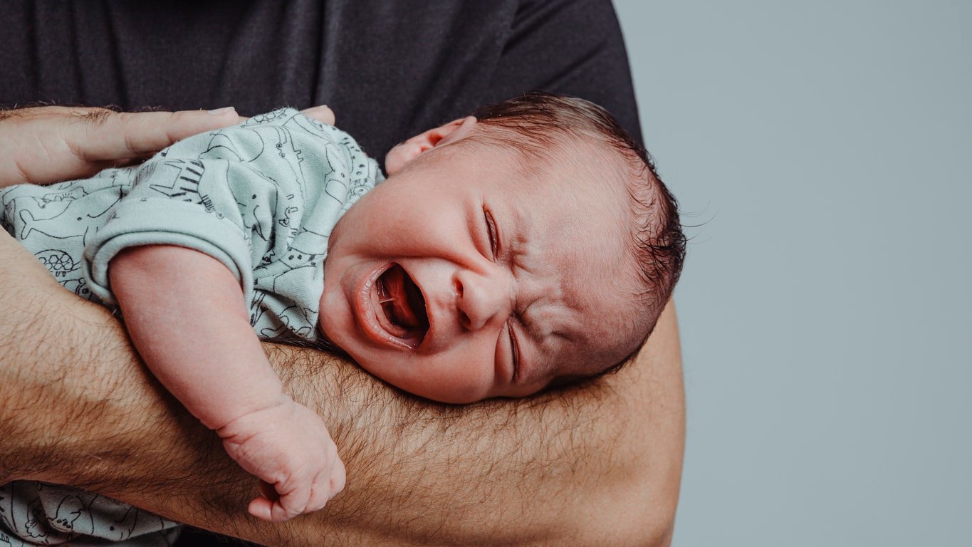 newborn on his father