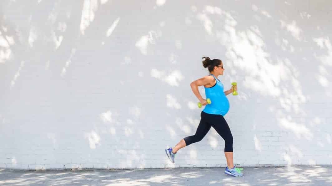 Pregnant woman running.